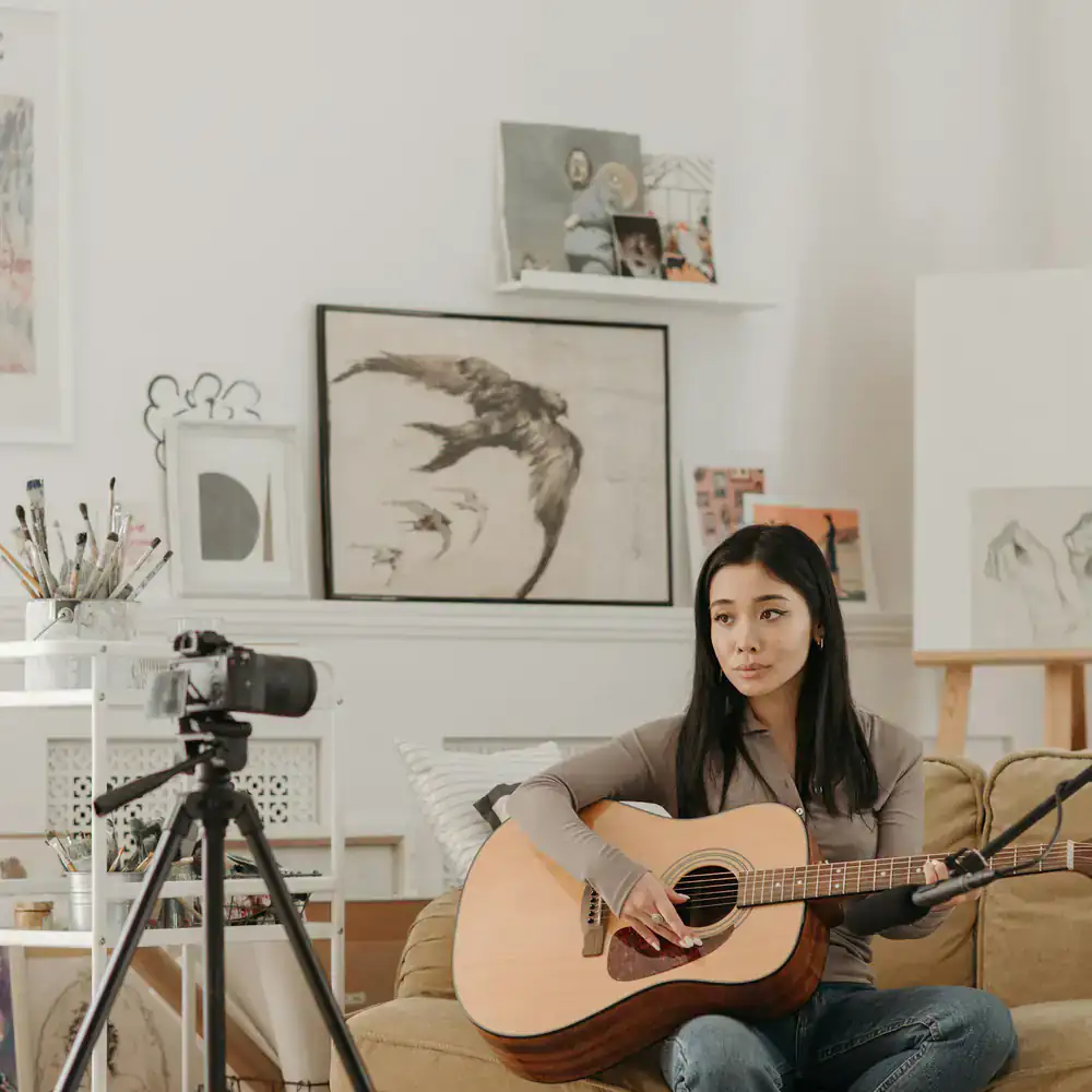 Camera and microphone recording a live acoustic folk music performance.